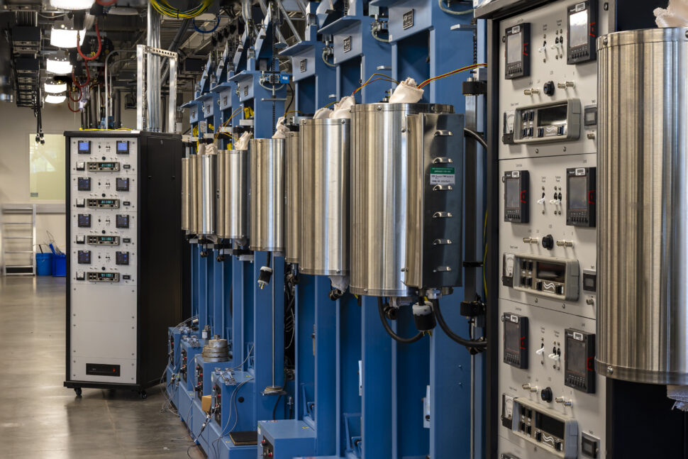 A row of door-sized blue and metallic columnar equipment