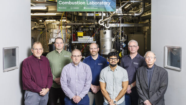 Robert Wagner, Vitaly Prikhodko, Josh Phil, Scott Curran, Daanish Tyrewala, Brian Kaul, and Ronald Graves gather to recognize Graves’ 50 years of mentorship and his work on ammonia engine research at ORNL.