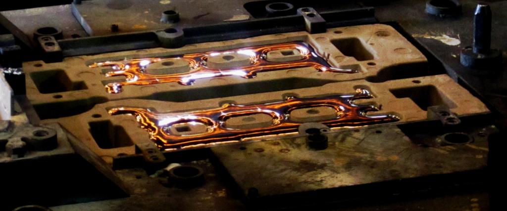 A picture of a molten hot alloy cooling in a mold.