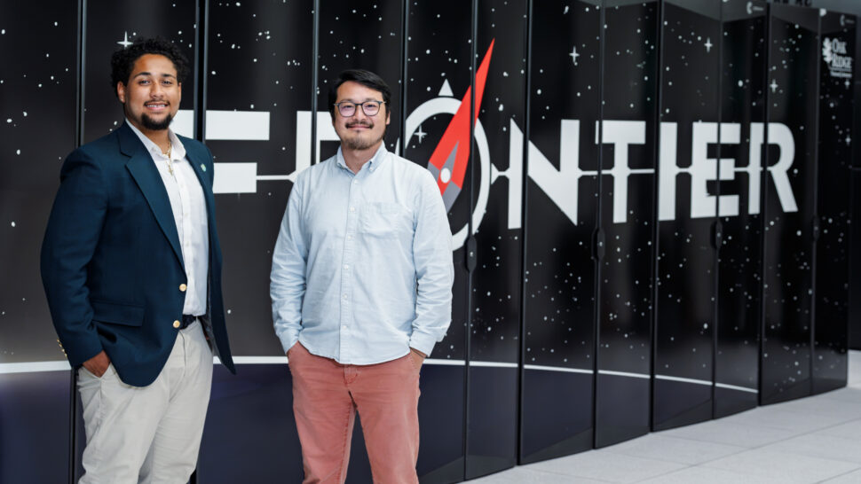 Miguel Kirby poses in front of the Frontier supercomputer in Building 5600.