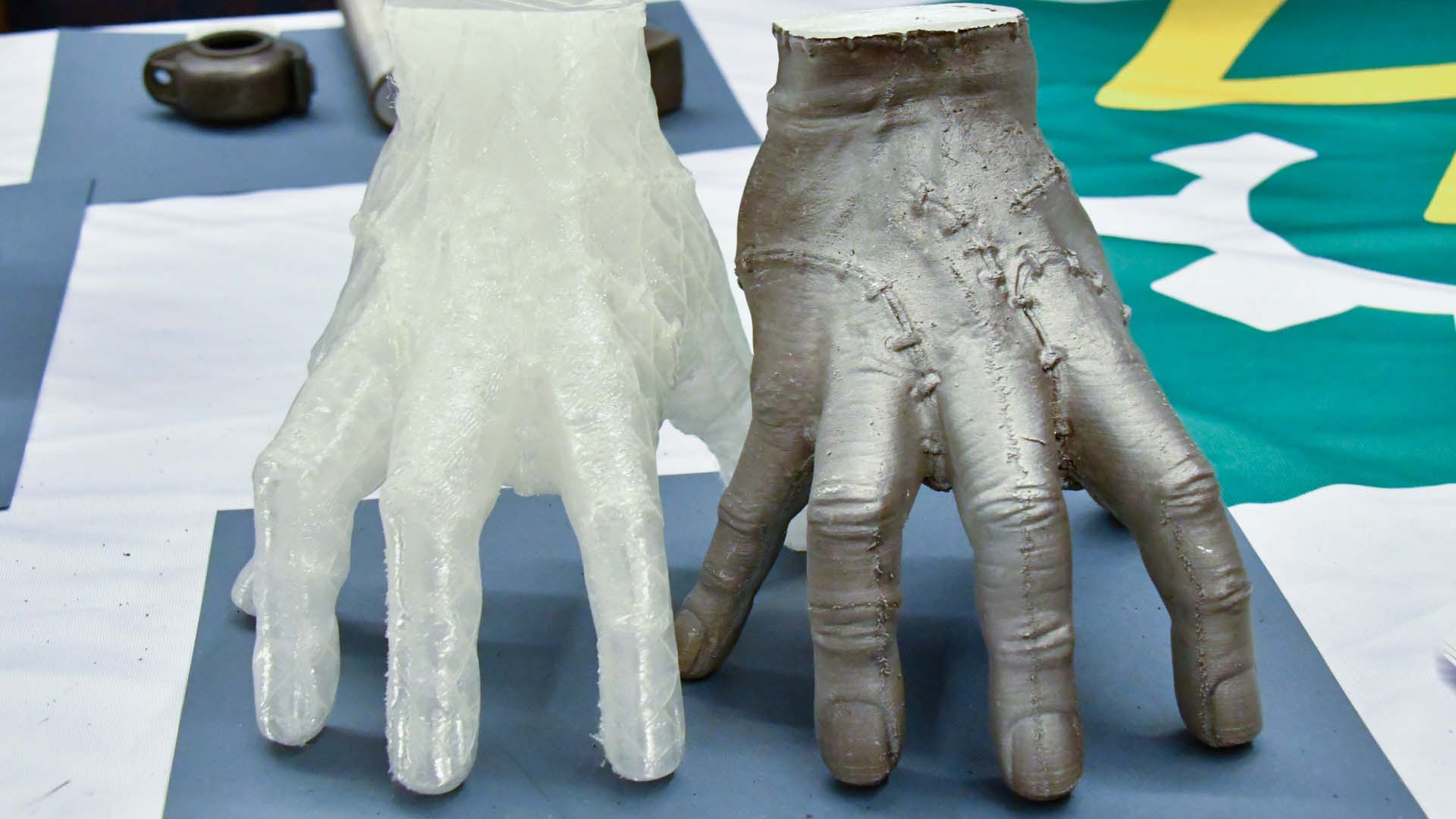 (1) A cast zombie hand and printed form demonstrate the level of detail that can be achieved using AMEC. Image via Skuld